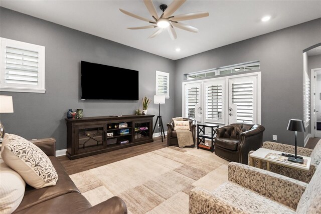 1212 Civitas Way, Winter Garden, FL 34787 - living area with a ceiling fan, arched walkways, wood finished floors, baseboards, and recessed lighting
