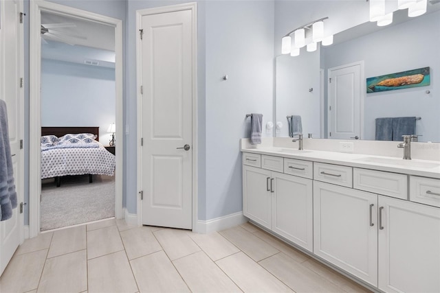 1212 Civitas Way, Winter Garden, FL 34787 - ensuite bathroom featuring double vanity, baseboards, tile patterned flooring, and ceiling fan