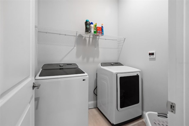 1212 Civitas Way, Winter Garden, FL 34787 - washroom featuring washer and dryer and light wood finished floors