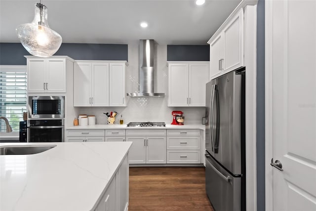 1212 Civitas Way, Winter Garden, FL 34787 - kitchen featuring stainless steel appliances, wall chimney exhaust hood, a sink, white cabinets, and recessed lighting