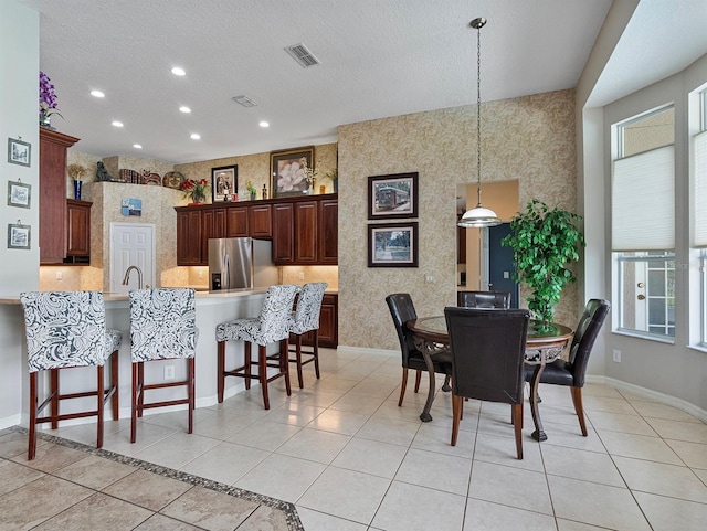 3840 Caledonia Ave, Apopka, FL 32712 - dining space featuring plenty of natural light, recessed lighting, wallpapered walls, baseboards, and light tile patterned floors