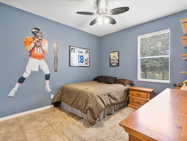 3840 Caledonia Ave, Apopka, FL 32712 - bedroom featuring light tile patterned floors, baseboards, and a ceiling fan