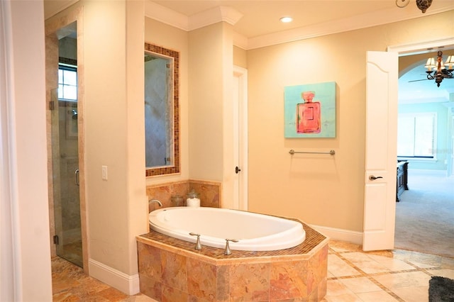 11013 Ullswater Ln, Windermere, FL 34786 - full bath featuring ornamental molding, a bath, healthy amount of natural light, a shower stall, and a chandelier