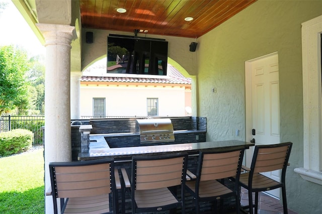 11013 Ullswater Ln, Windermere, FL 34786 - view of patio / terrace featuring an outdoor kitchen, fence, and grilling area