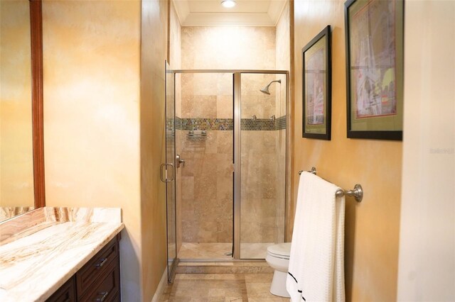 11013 Ullswater Ln, Windermere, FL 34786 - bathroom with a stall shower, toilet, vanity, ornamental molding, and tile patterned flooring