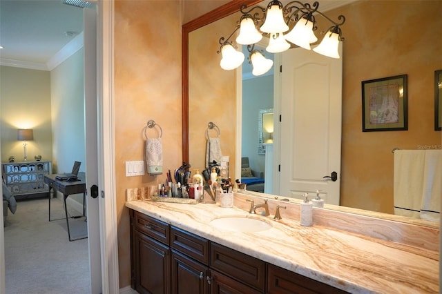 11013 Ullswater Ln, Windermere, FL 34786 - bathroom with connected bathroom, ornamental molding, vanity, and a chandelier