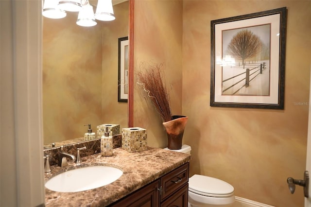 11013 Ullswater Ln, Windermere, FL 34786 - half bathroom featuring toilet, vanity, baseboards, and a chandelier