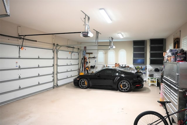 11013 Ullswater Ln, Windermere, FL 34786 - garage featuring a garage door opener