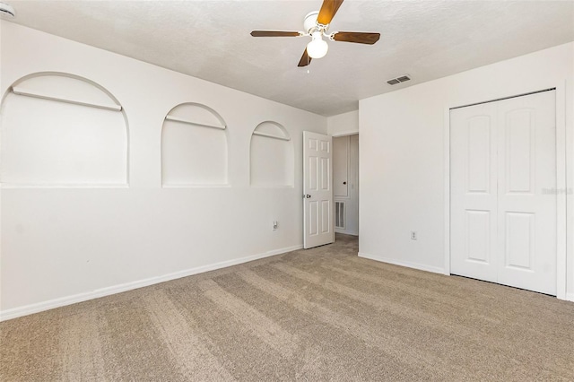9532 Water Fern Cir, Clermont, FL 34711 - unfurnished bedroom with carpet flooring, baseboards, a closet, and ceiling fan
