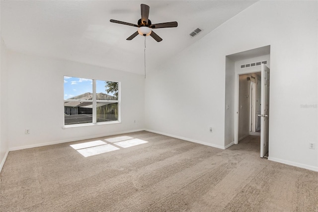 unfurnished room featuring vaulted ceiling, carpet floors, a ceiling fan, and baseboards