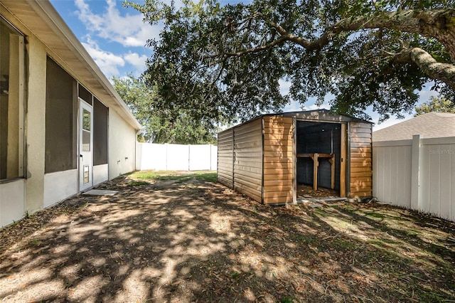 9532 Water Fern Cir, Clermont, FL 34711 - fenced backyard with a shed and an outbuilding