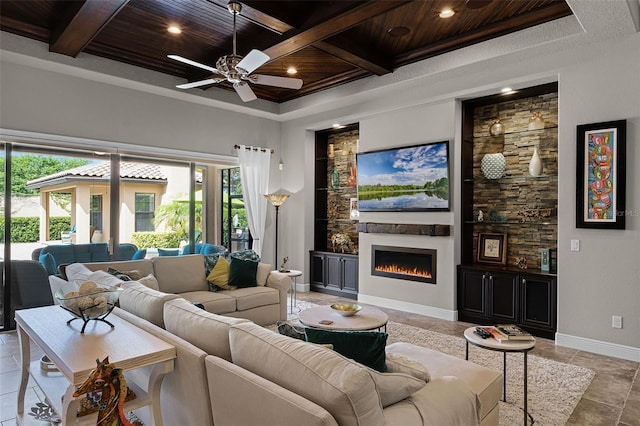 11755 Waterstone Loop Dr, Windermere, FL 34786 - living area featuring plenty of natural light, wood ceiling, ceiling fan, coffered ceiling, and a lit fireplace