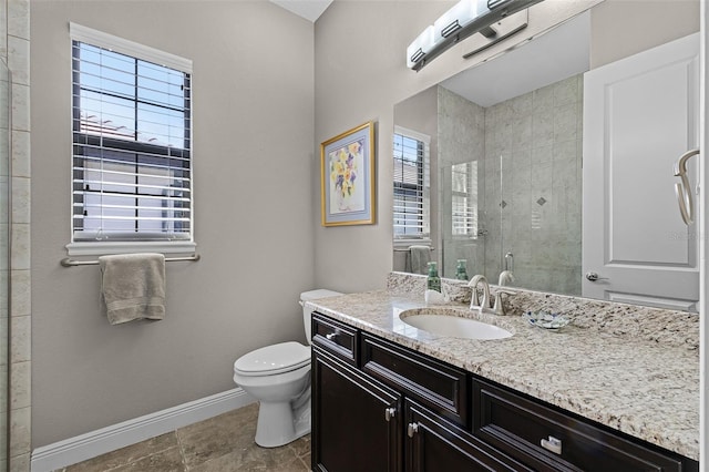 11755 Waterstone Loop Dr, Windermere, FL 34786 - bathroom with baseboards, a stall shower, toilet, and vanity