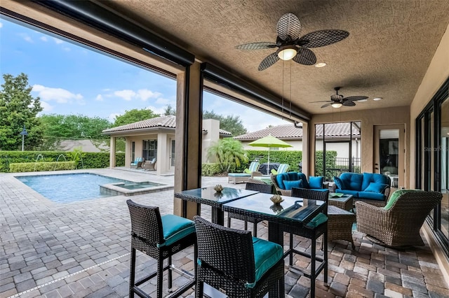 11755 Waterstone Loop Dr, Windermere, FL 34786 - view of patio / terrace with ceiling fan, outdoor lounge area, and a pool with connected hot tub