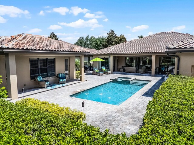 11755 Waterstone Loop Dr, Windermere, FL 34786 - view of pool with an outdoor hangout area, a patio, and a pool with connected hot tub