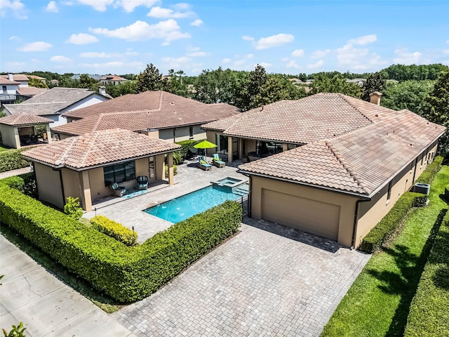 11755 Waterstone Loop Dr, Windermere, FL 34786 - view of pool featuring a pool with connected hot tub and a residential view