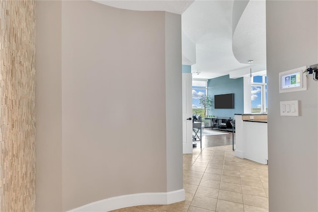 101 S Eola Dr Unit 810, Orlando, FL 32801 - hall with light tile patterned floors and baseboards