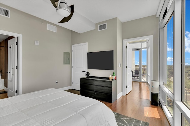 101 S Eola Dr Unit 810, Orlando, FL 32801 - bedroom featuring electric panel, wood finished floors, baseboards, and ceiling fan