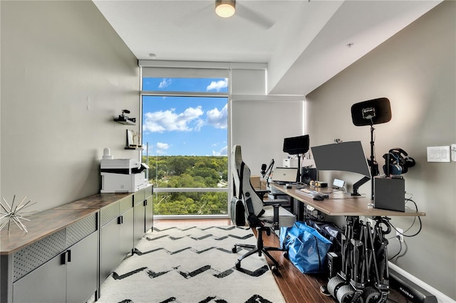 101 S Eola Dr Unit 810, Orlando, FL 32801 - office area featuring a wall of windows, wood finished floors, and a ceiling fan