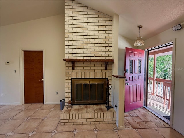 entryway featuring vaulted ceiling, tile patterned flooring, baseboards, and a brick fireplace