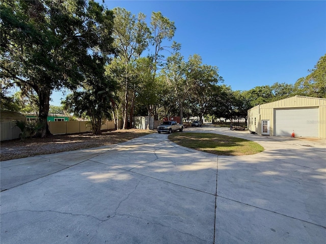 4981 Lake Cecile Dr, Kissimmee, FL 34746 - view of yard featuring concrete driveway and a garage