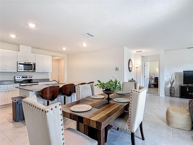 3354 Aruba Way, Haines City, FL 33844 - dining space with light tile patterned floors and recessed lighting