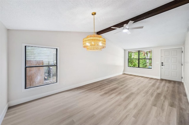 1957 Deloy Dr, Daytona Beach, FL 32119 - unfurnished room with wood finished floors, a ceiling fan, baseboards, and a textured ceiling