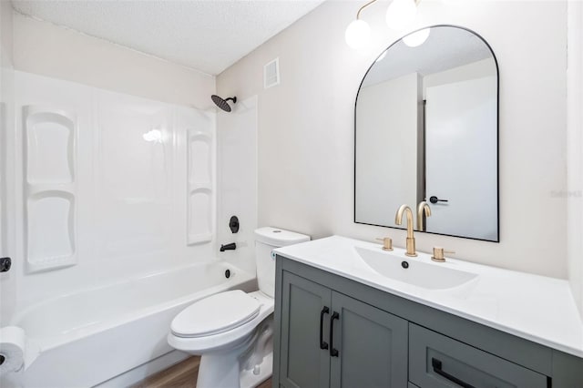 1957 Deloy Dr, Daytona Beach, FL 32119 - full bathroom featuring a textured ceiling, toilet, vanity, shower / bathtub combination, and wood finished floors