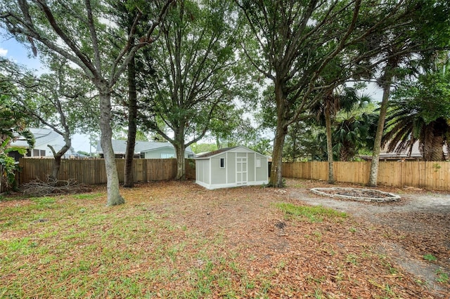 1957 Deloy Dr, Daytona Beach, FL 32119 - fenced backyard with a storage unit and an outbuilding