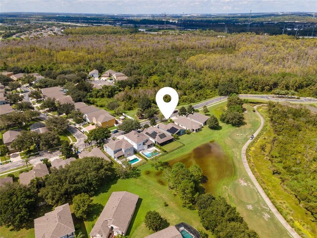 9563 Myrtle Creek Ln, Orlando, FL 32832 - aerial overview of property's location with nearby suburban area and a heavily wooded area