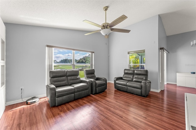 9563 Myrtle Creek Ln, Orlando, FL 32832 - living area featuring ceiling fan, wood finished floors, baseboards, a textured ceiling, and high vaulted ceiling