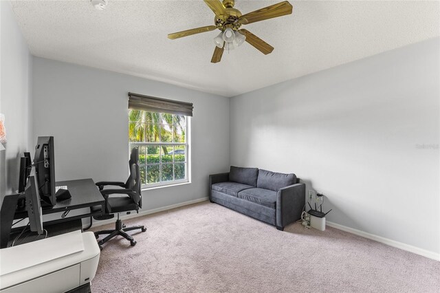 9563 Myrtle Creek Ln, Orlando, FL 32832 - carpeted home office with ceiling fan, a textured ceiling, and baseboards