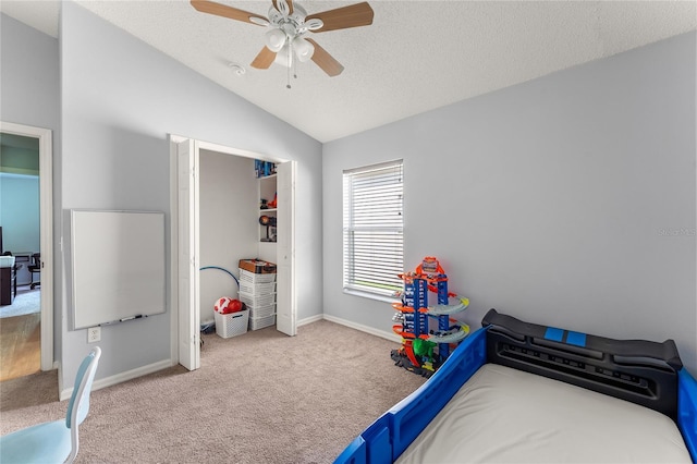 9563 Myrtle Creek Ln, Orlando, FL 32832 - carpeted bedroom with vaulted ceiling, a textured ceiling, baseboards, and ceiling fan