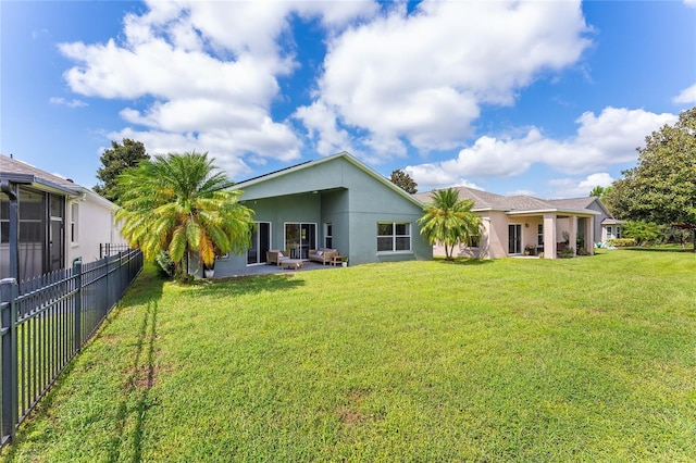 9563 Myrtle Creek Ln, Orlando, FL 32832 - rear view of house with stucco siding and a patio area