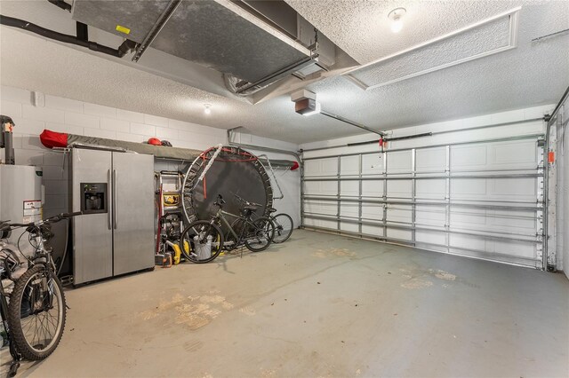 9563 Myrtle Creek Ln, Orlando, FL 32832 - garage with stainless steel fridge with ice dispenser, a garage door opener, and concrete block wall