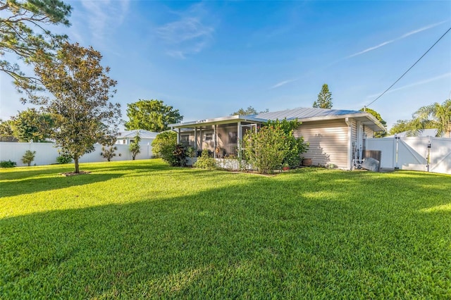1566 Damask Ln, Sebastian, FL 32958 - rear view of property with a gate and a sunroom