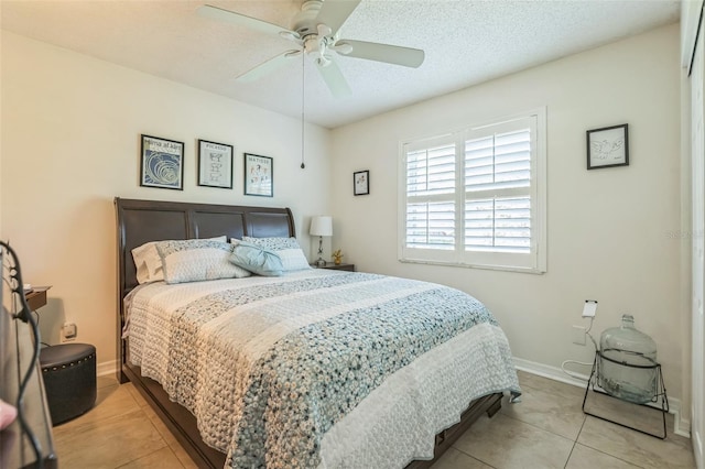 1566 Damask Ln, Sebastian, FL 32958 - bedroom with light tile patterned floors, baseboards, a ceiling fan, and a textured ceiling