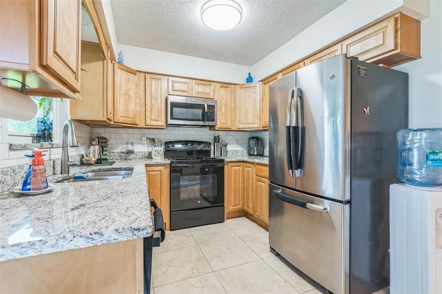 1566 Damask Ln, Sebastian, FL 32958 - kitchen featuring appliances with stainless steel finishes, a sink, tasteful backsplash, a textured ceiling, and light stone countertops