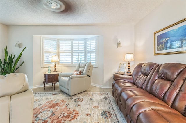1566 Damask Ln, Sebastian, FL 32958 - living room featuring light tile patterned floors, baseboards, and a textured ceiling