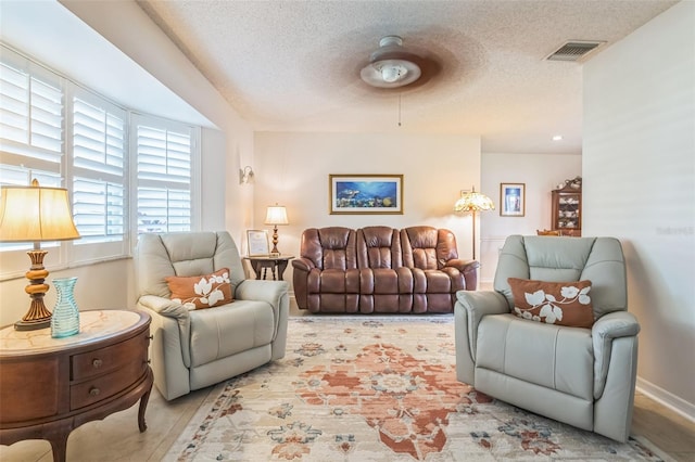 1566 Damask Ln, Sebastian, FL 32958 - living area with a textured ceiling and a ceiling fan