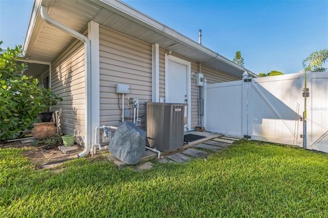 1566 Damask Ln, Sebastian, FL 32958 - view of side of home featuring central air condition unit and a gate