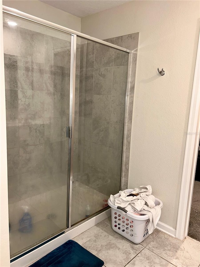 4427 Blackbird St, Kissimmee, FL 34746 - bathroom featuring a stall shower and tile patterned flooring
