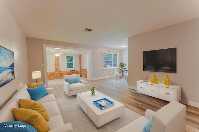 635 San Lanta Cir, Sanford, FL 32771 - living room with light wood-style flooring, baseboards, and a ceiling fan