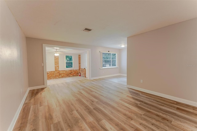 635 San Lanta Cir, Sanford, FL 32771 - spare room featuring light wood finished floors, baseboards, and a ceiling fan