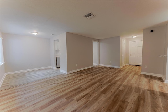 635 San Lanta Cir, Sanford, FL 32771 - empty room with light wood-style floors and baseboards