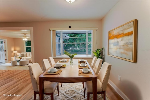 635 San Lanta Cir, Sanford, FL 32771 - dining room featuring wood finished floors, baseboards, and a ceiling fan