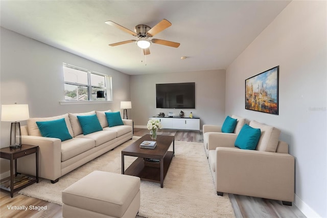 635 San Lanta Cir, Sanford, FL 32771 - living area featuring light wood-type flooring, a ceiling fan, and baseboards