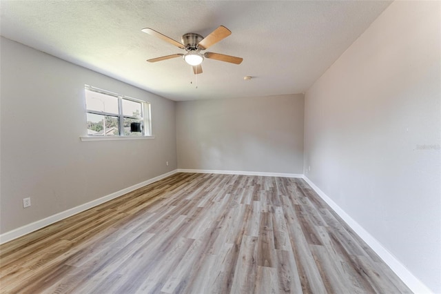 635 San Lanta Cir, Sanford, FL 32771 - unfurnished room with wood finished floors, a ceiling fan, baseboards, and a textured ceiling