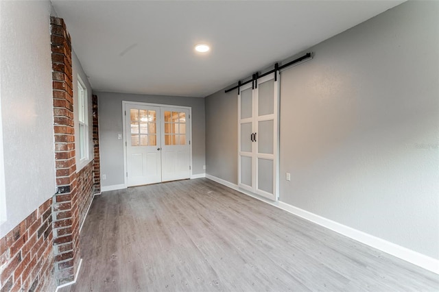 635 San Lanta Cir, Sanford, FL 32771 - unfurnished sunroom featuring a barn door and french doors