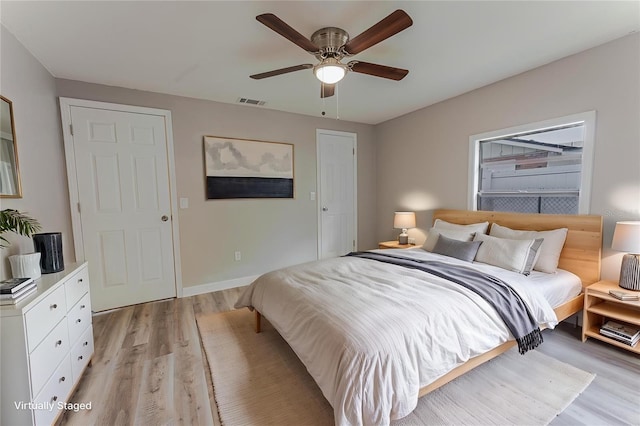 635 San Lanta Cir, Sanford, FL 32771 - bedroom with light wood-style flooring, a ceiling fan, and baseboards